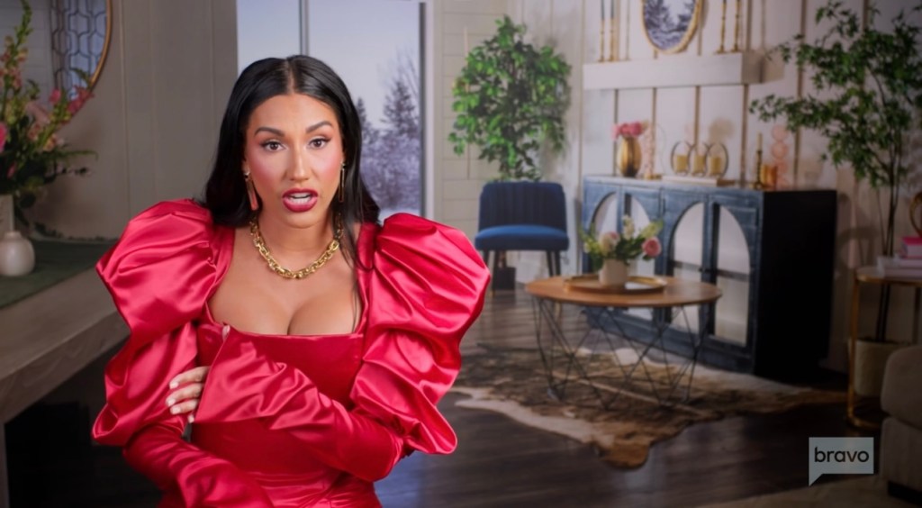 Monica Garcia wears red satin dress with puffy sleeves in RHOSLC season 4 confessional interview