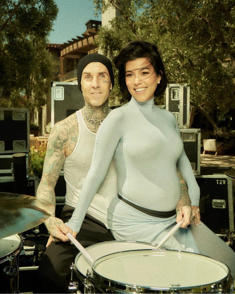 Kourtney Kardashian and Travis Barker show off Kourtney's pregnancy at BLINK-182 performance
