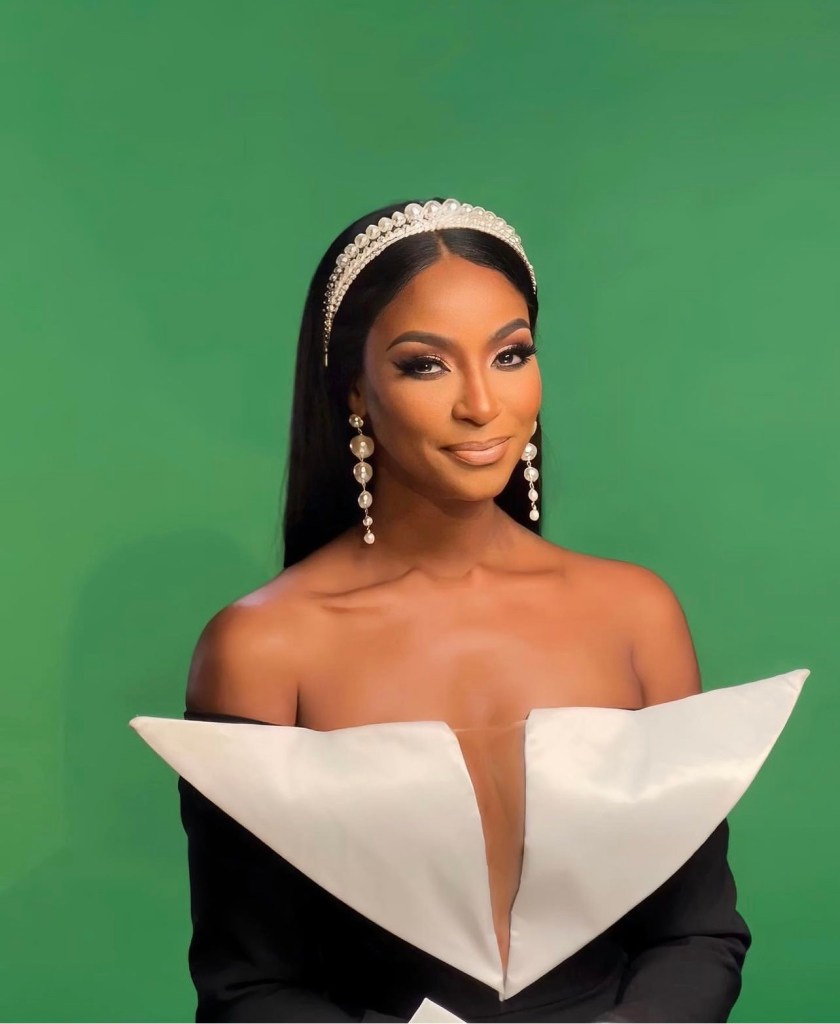 Guerdy Abraira wears off the shoulder black and white dress with pearl accessories for confessional look