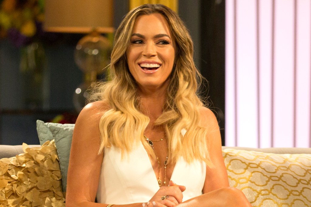 RHOBH alum Teddi Mellencamp laughs in white low cut dress at reunion