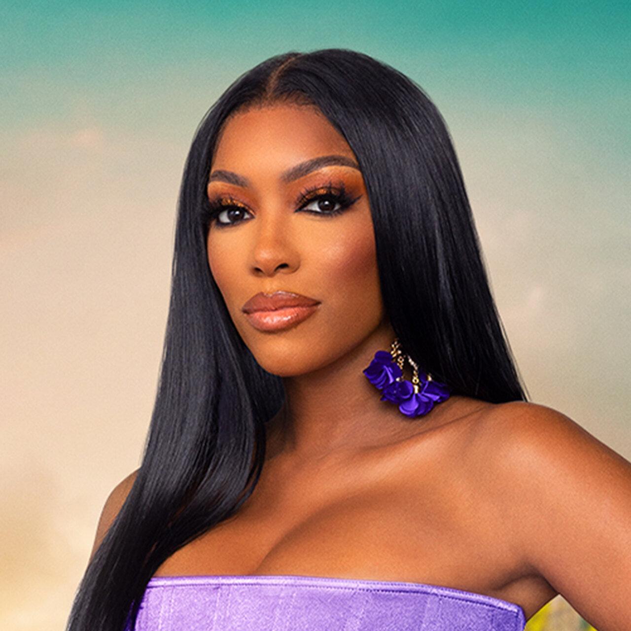 Porsha Williams wears strapless purple dress with matching earrings for RHUT cast photo