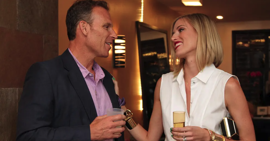 Real Housewives of New York alums Kristen and Josh Taekman smile at each other lovingly