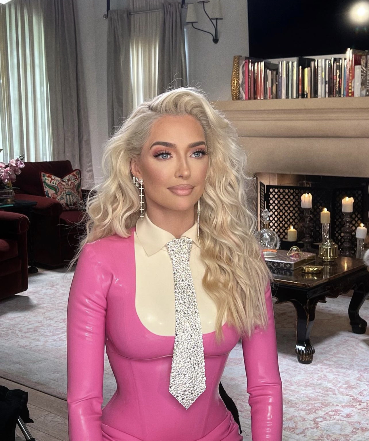 Erika Jayne in pink latex look with silver tie for RHOBH season 13 confessional interview